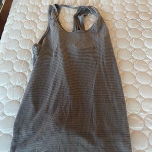 Athleta loose look, open back detail workout tank. Ties in back.